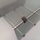 Table basse vintage en verre fumé, métal noir et fonte d’aluminium