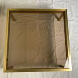 Table basse en verre et laiton
