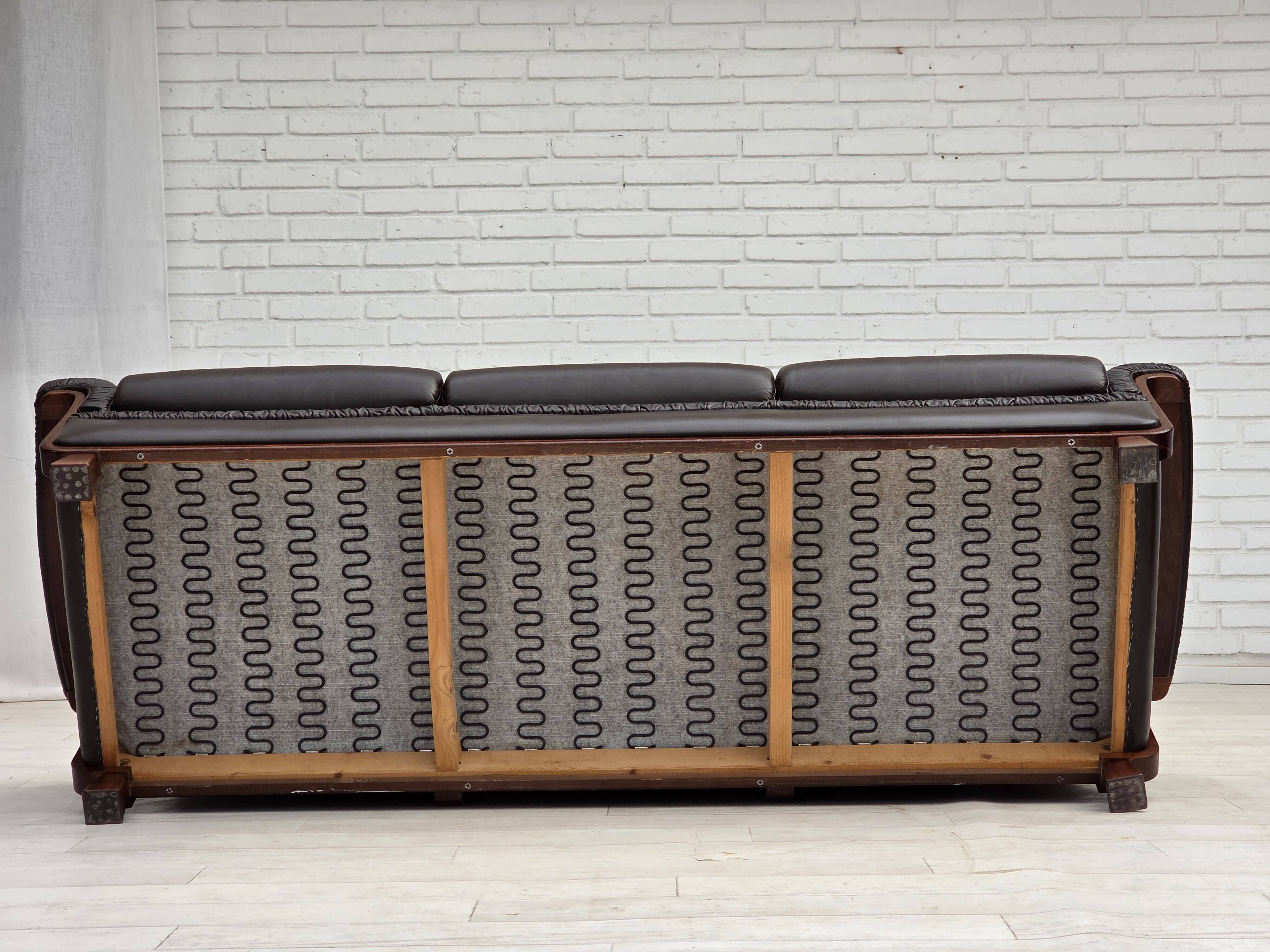 1970s, Scandinavian 3-seater sofa, furniture leather, teak wood legs.