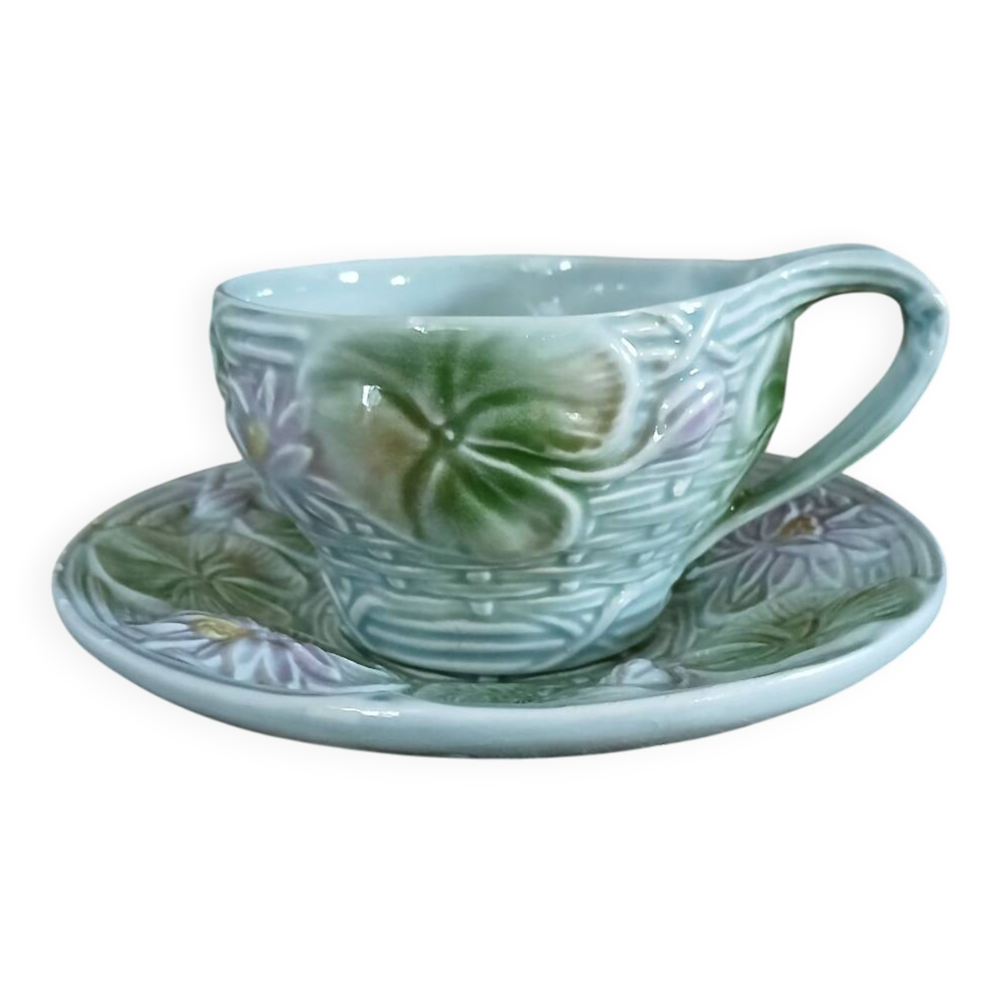 Antique cup and saucer in majolica.