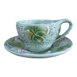 Antique cup and saucer in majolica.