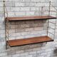 Shelf 1950 has 70 gold uprights and and plating shelf with black plastic border,