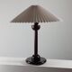 Vintage table in postmodern Art Deco revival with pleated lampshade.