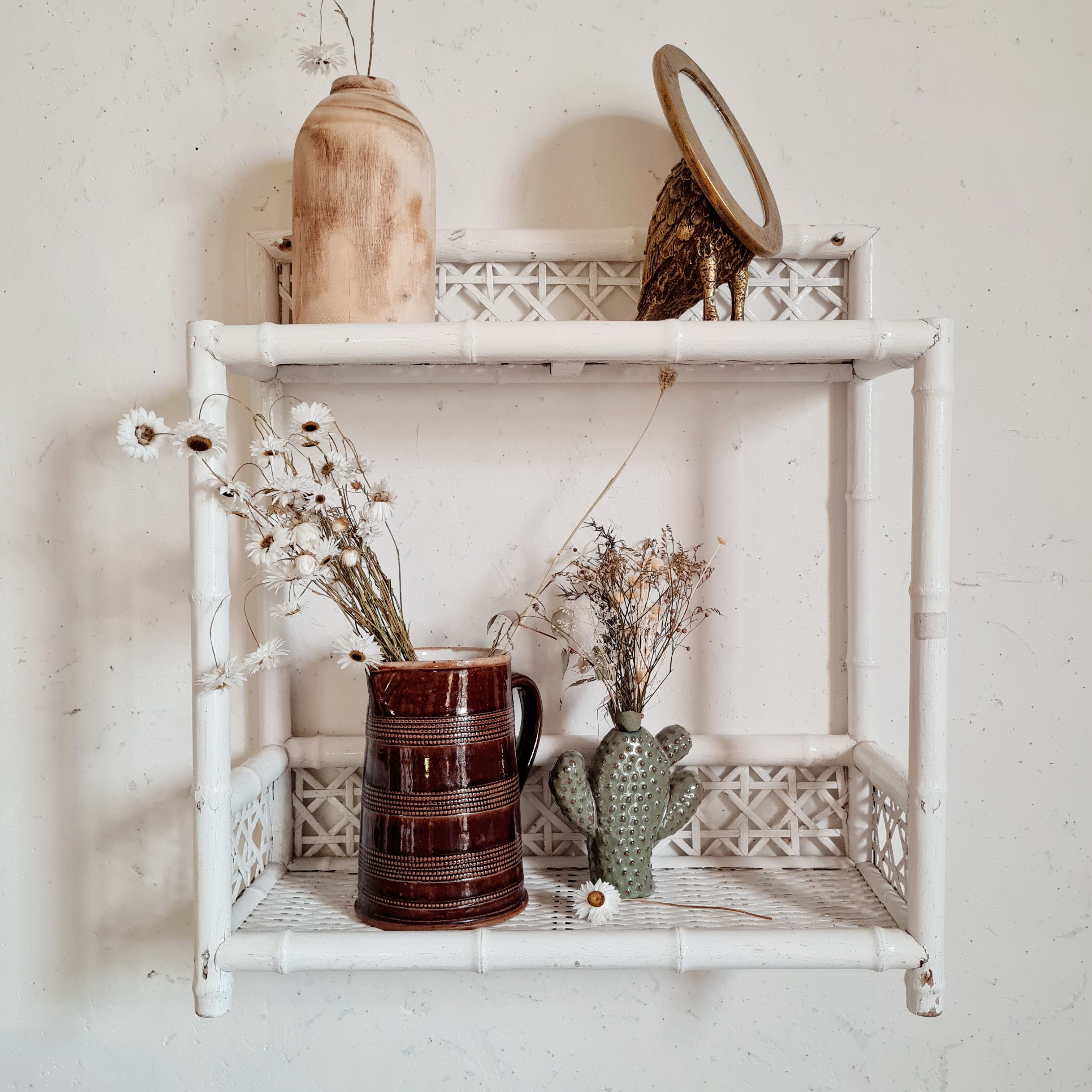 Vintage rattan and bamboo shelves painted white