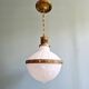 Large Art Deco pendant light in milk glass and brass, 1920s
