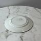 Set of 2 Saint Amand plates with laurel crown decoration.
