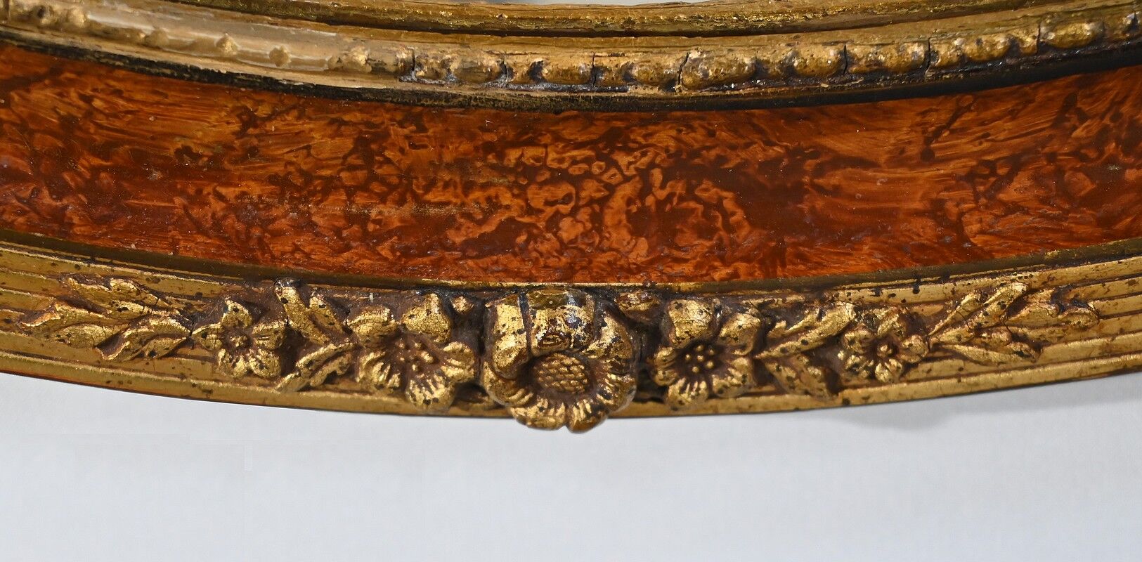 Oval mirror in gilded wood – early twentieth century