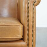 Sheep leather club chair in neutral cognac colour and in good condition