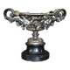 Patinated bronze cup, richly decorated with foliage and bunches of grapes