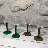 Antique and rare! Sold in a set of 12 colorful twisted stemmed glasses engraved with flowers and leaves