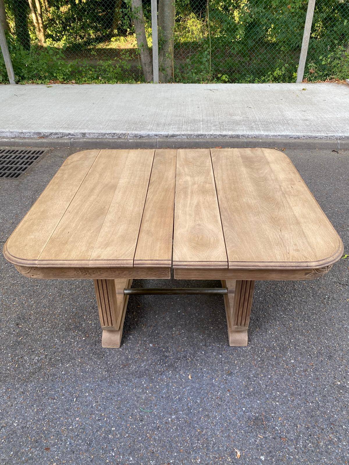 Rectangular Art Deco dining table with a central pedestal, stripped in solid oak.