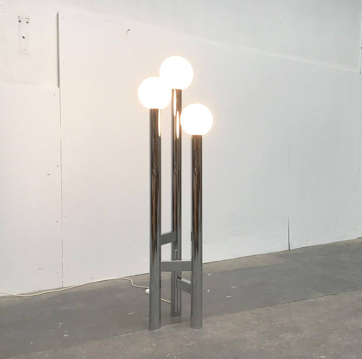 Vintage German floor lamp from the space age of the 1970s in glass and metal.