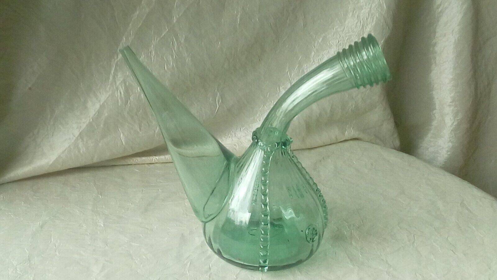 Blown glass carafe with a goat design.