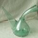 Blown glass carafe with a goat design.