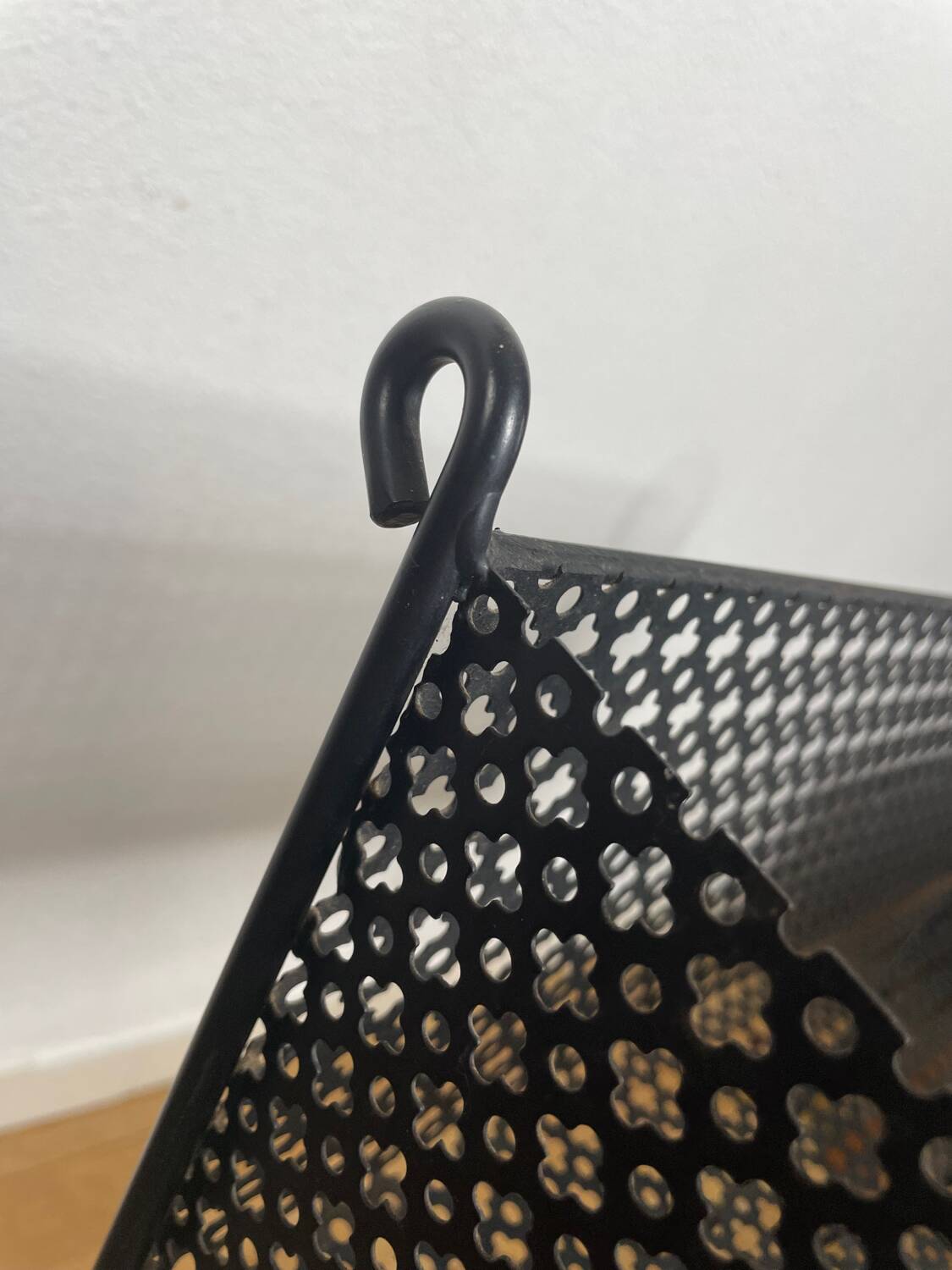 1950s black perforated metal planter in the style of Mathieu MATEGOT