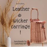 Wicker basket on wheels with leather flap