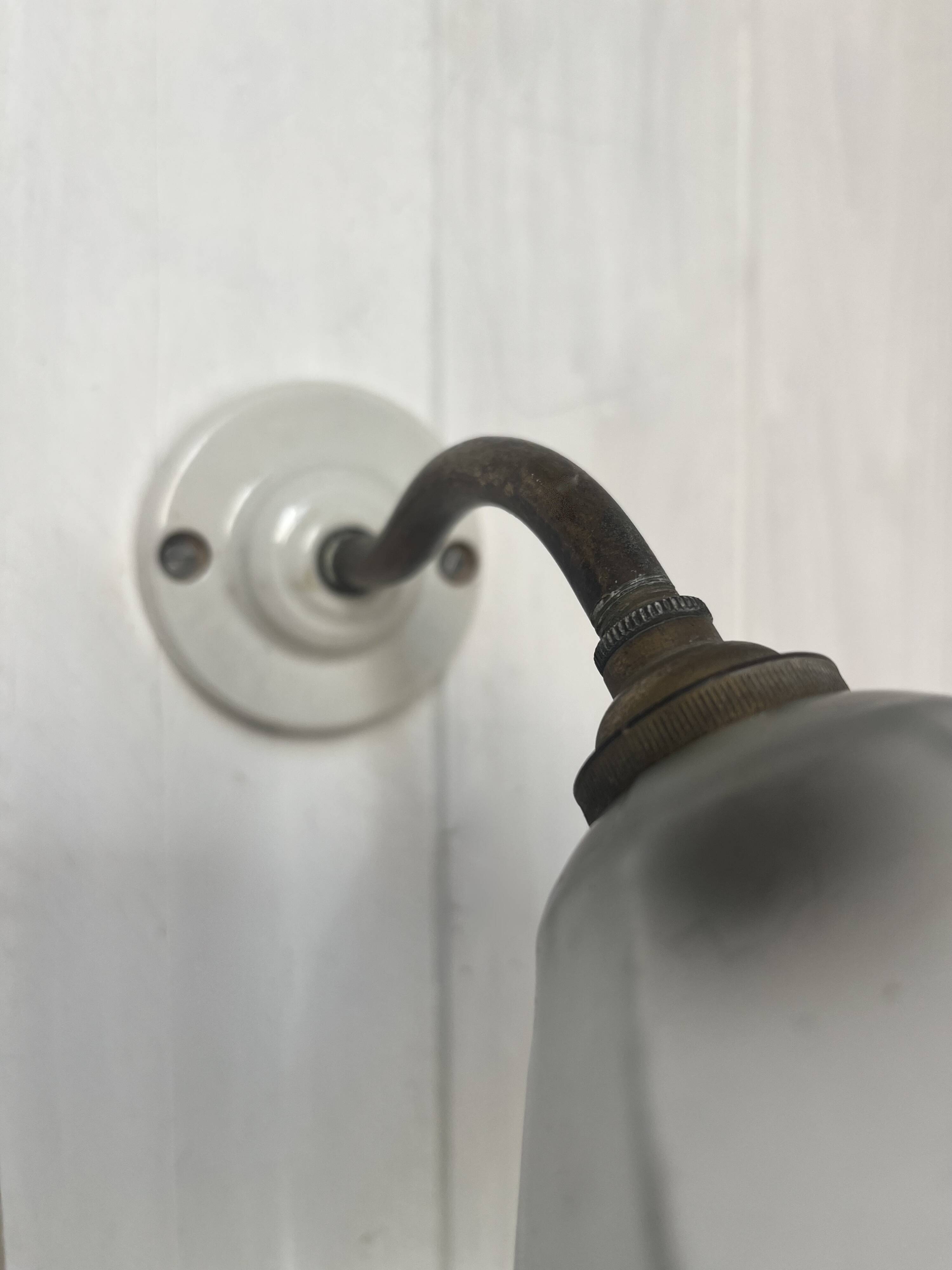Swan neck wall light on porcelain base