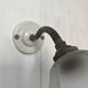 Swan neck wall light on porcelain base