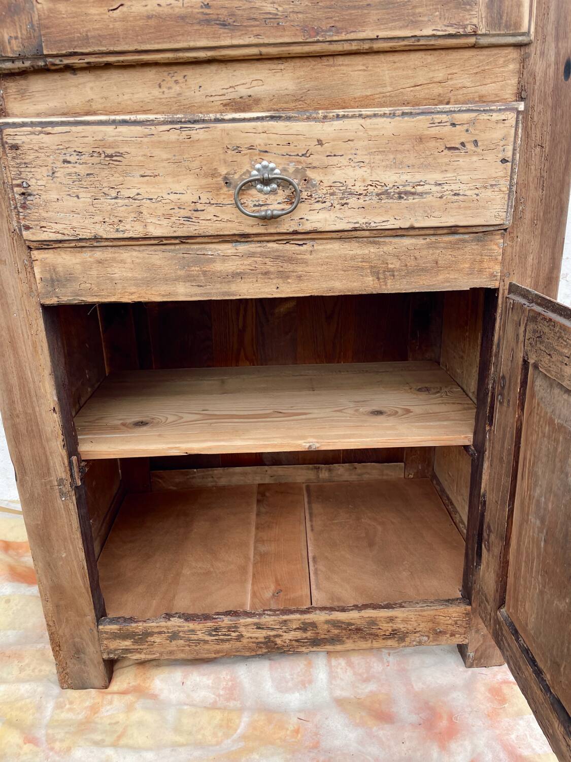 Rustic and vintage wardrobe in raw wood, wabi-sabi style.