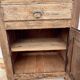 Rustic and vintage wardrobe in raw wood, wabi-sabi style.
