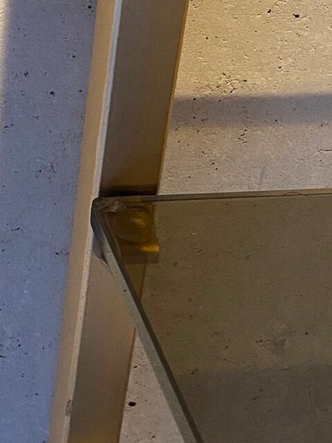 Golden brass and glass shelves