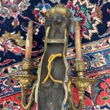 Pair of gilt bronze wall sconces with caryatid and Atlante decoration, 18th century.