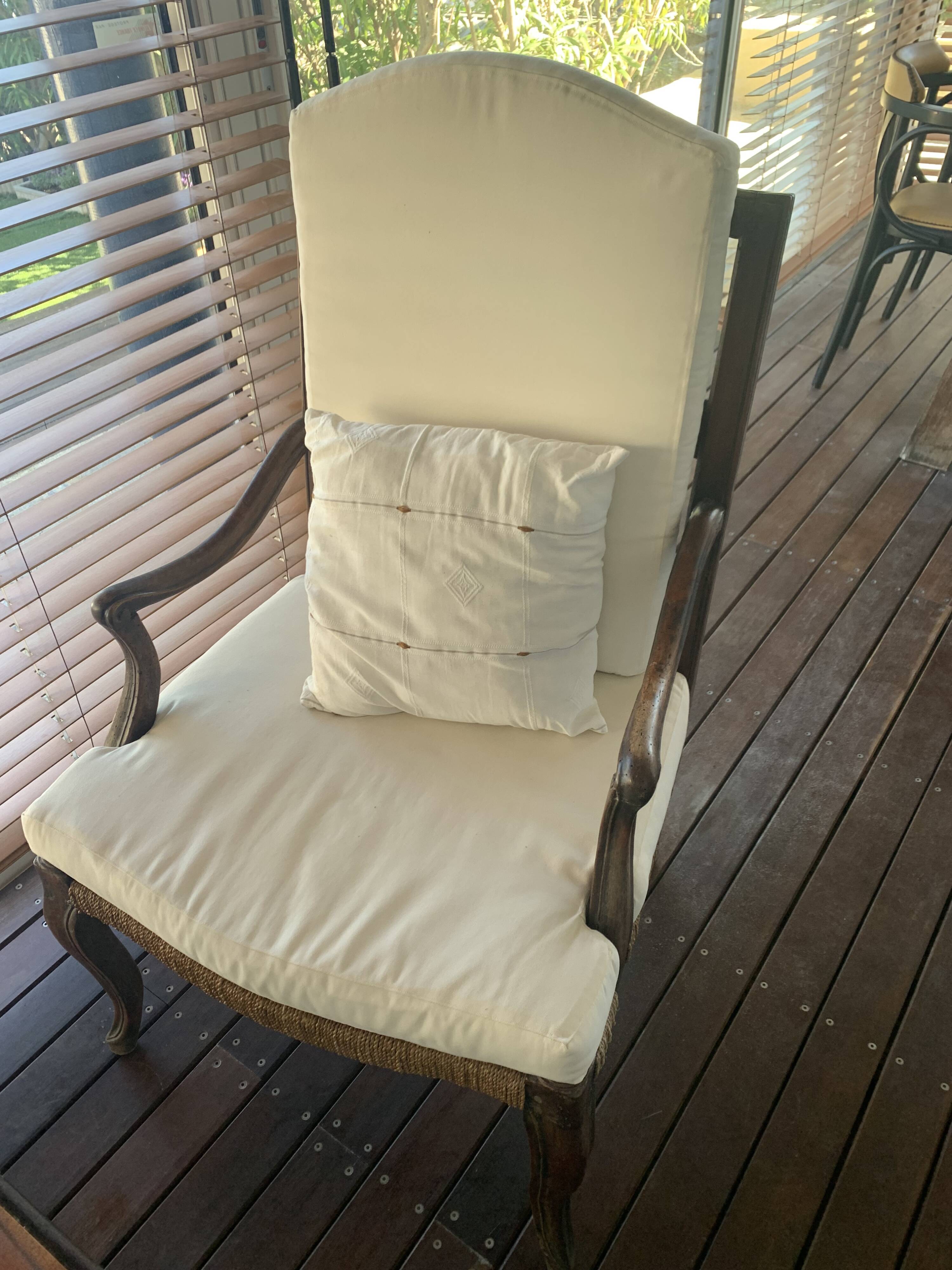 Pair of antique wooden armchairs with woven seats + cushions