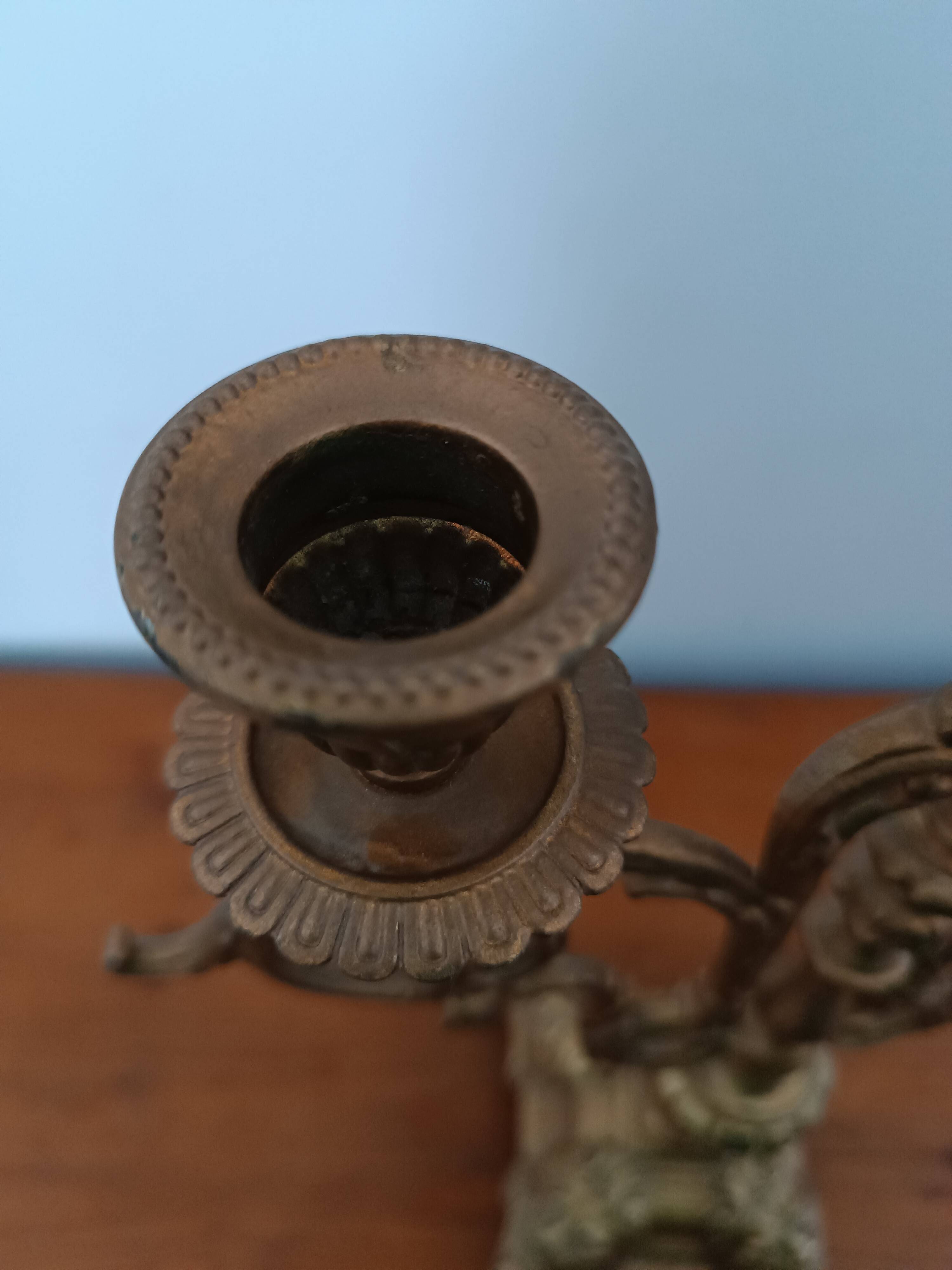 Bronze candlestick with lion head decoration