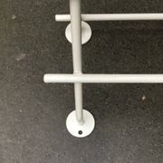 Mid-century modern minimalist metal coat rack from the 1960s.