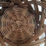 Wall composition of seven baskets and wicker trays.