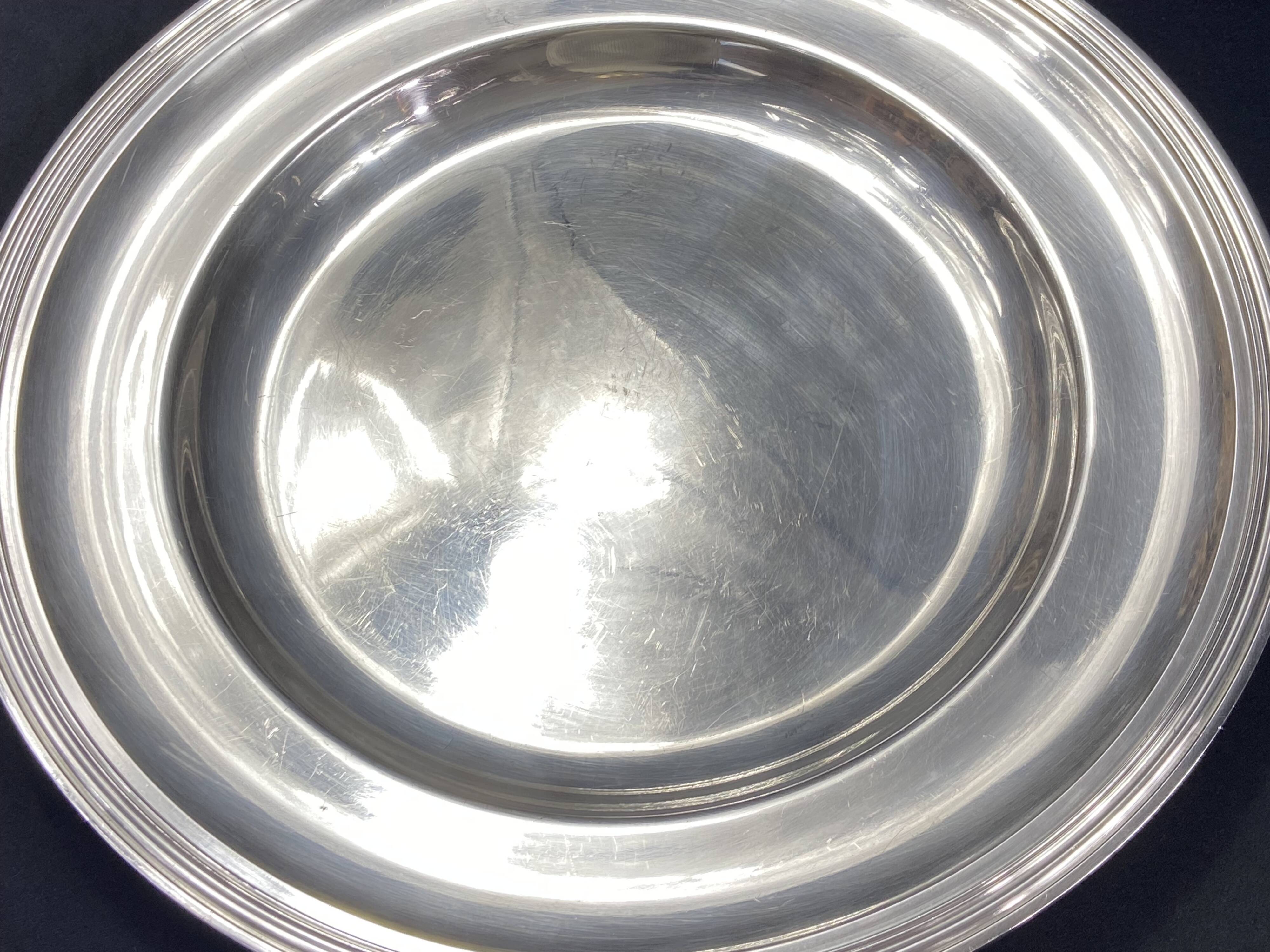 Circular silver-plated metal dish signed ercuis