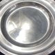 Circular silver-plated metal dish signed ercuis