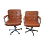 Brown leather armchairs