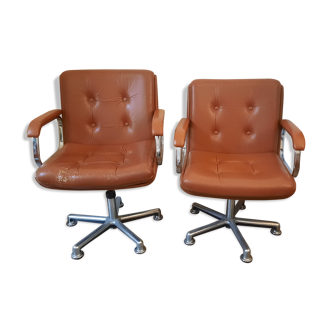 Brown leather armchairs