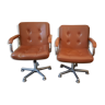 Brown leather armchairs