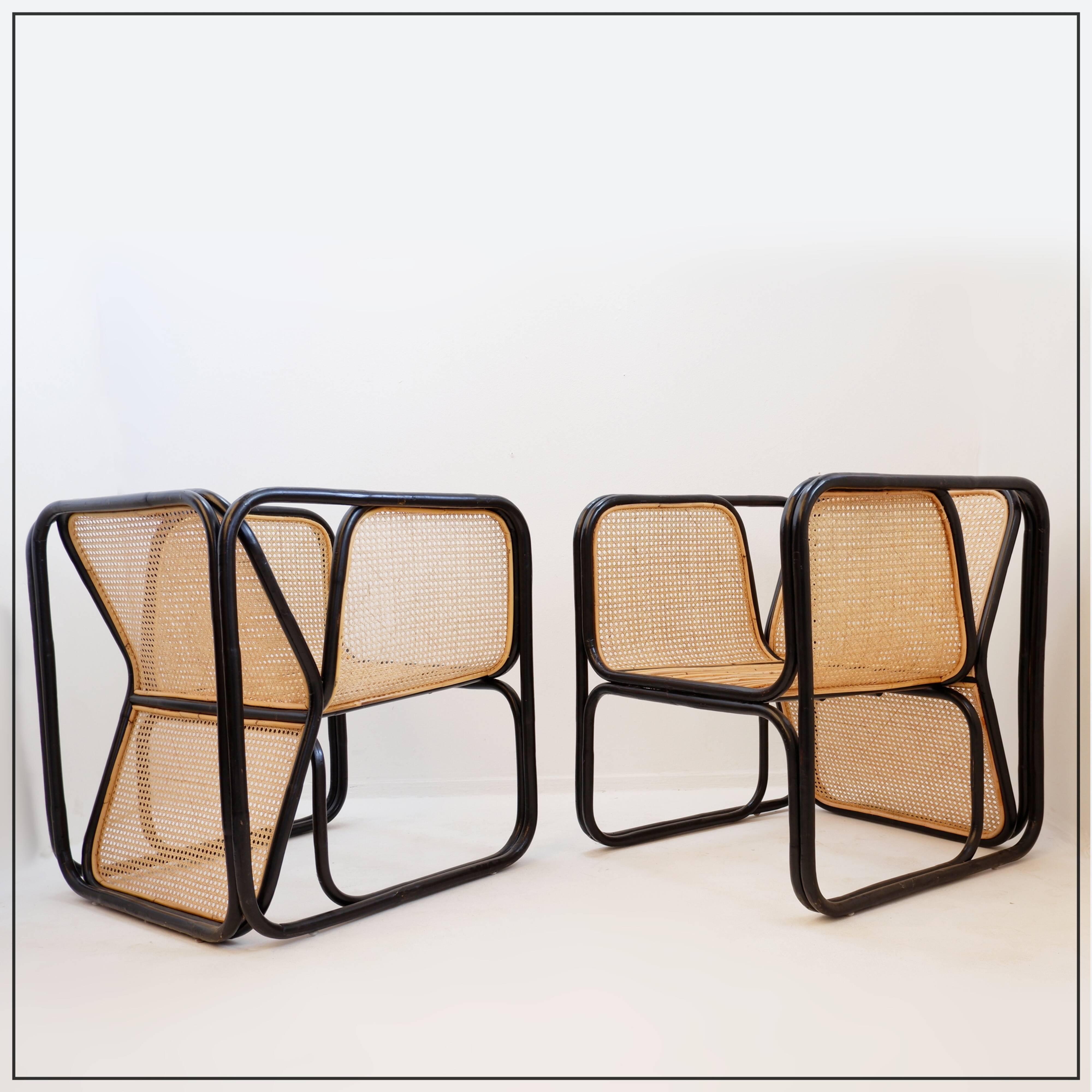 Pair of designer armchairs in curved wood and wicker