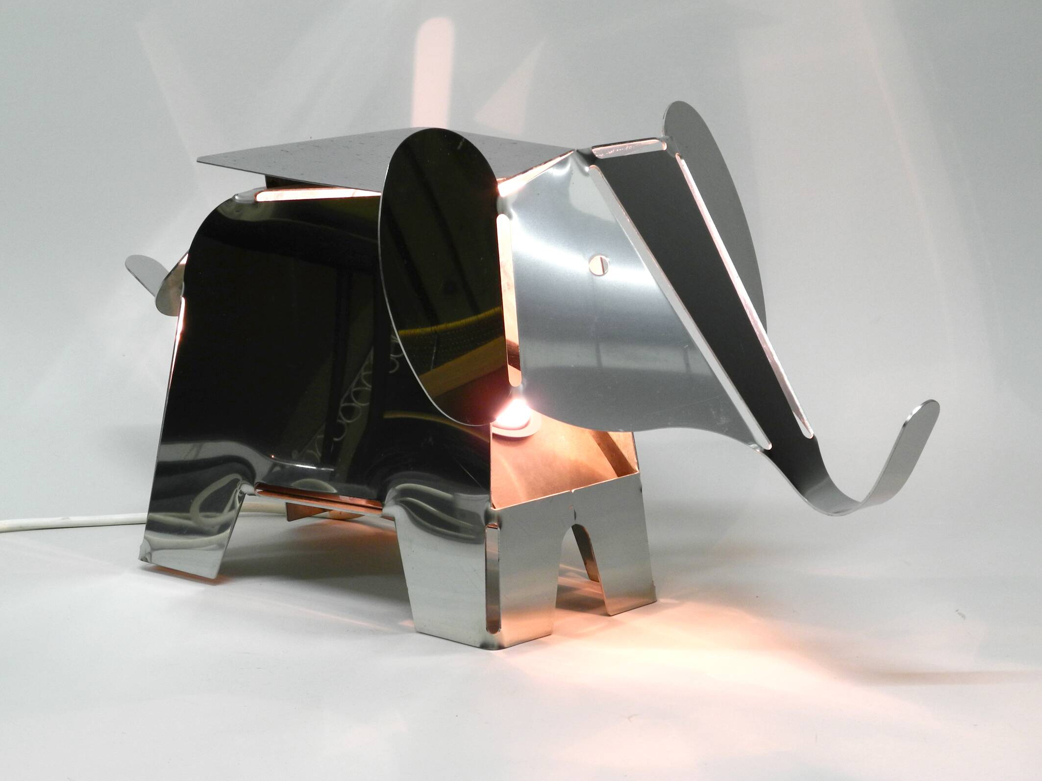 80s heavy metal chrome elephant floor lamp as side table Postmodern design