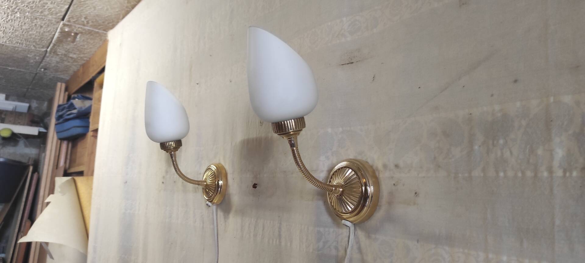 Articulated brass and opaline wall lights - mid 20th century.