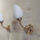Articulated brass and opaline wall lights - mid 20th century.