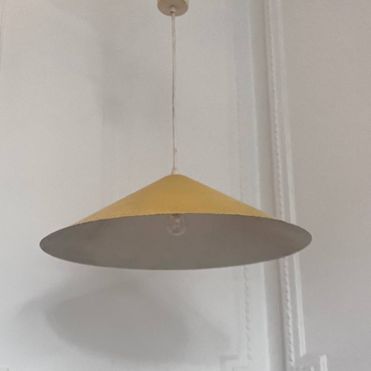 Yellow perforated sheet metal suspension