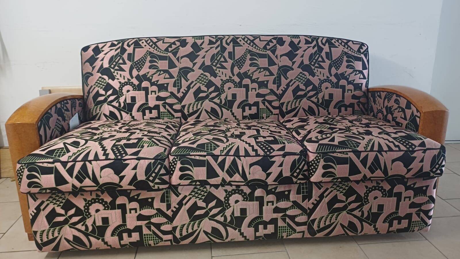 Convertible sofa and art deco armchair in lelievre fabrics.
