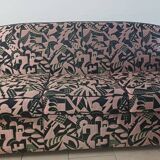 Convertible sofa and art deco armchair in lelievre fabrics.