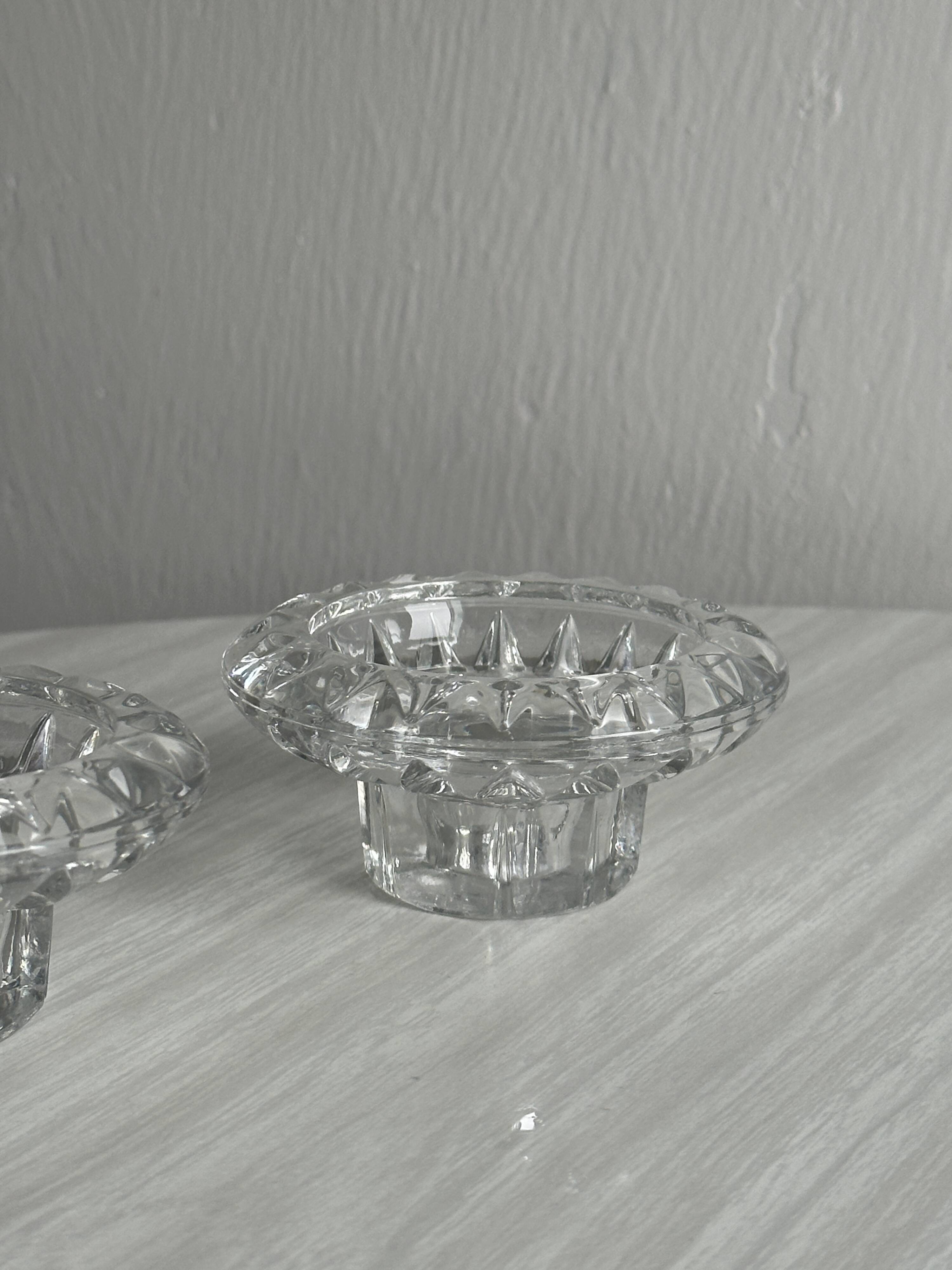 Duo of small candlesticks in chiseled glass