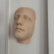 Wall sculpture of the face of the Venus de Milo in plaster.