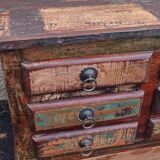 Furniture low in colorful wood. 12 drawers and 1 door
