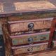 Furniture low in colorful wood. 12 drawers and 1 door