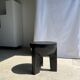 Black mango wood tripod side table with a semi-spherical top, height: 45 cm, diameter: 44 cm.