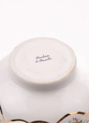 Brussels porcelain vase with a gold rim and flowers