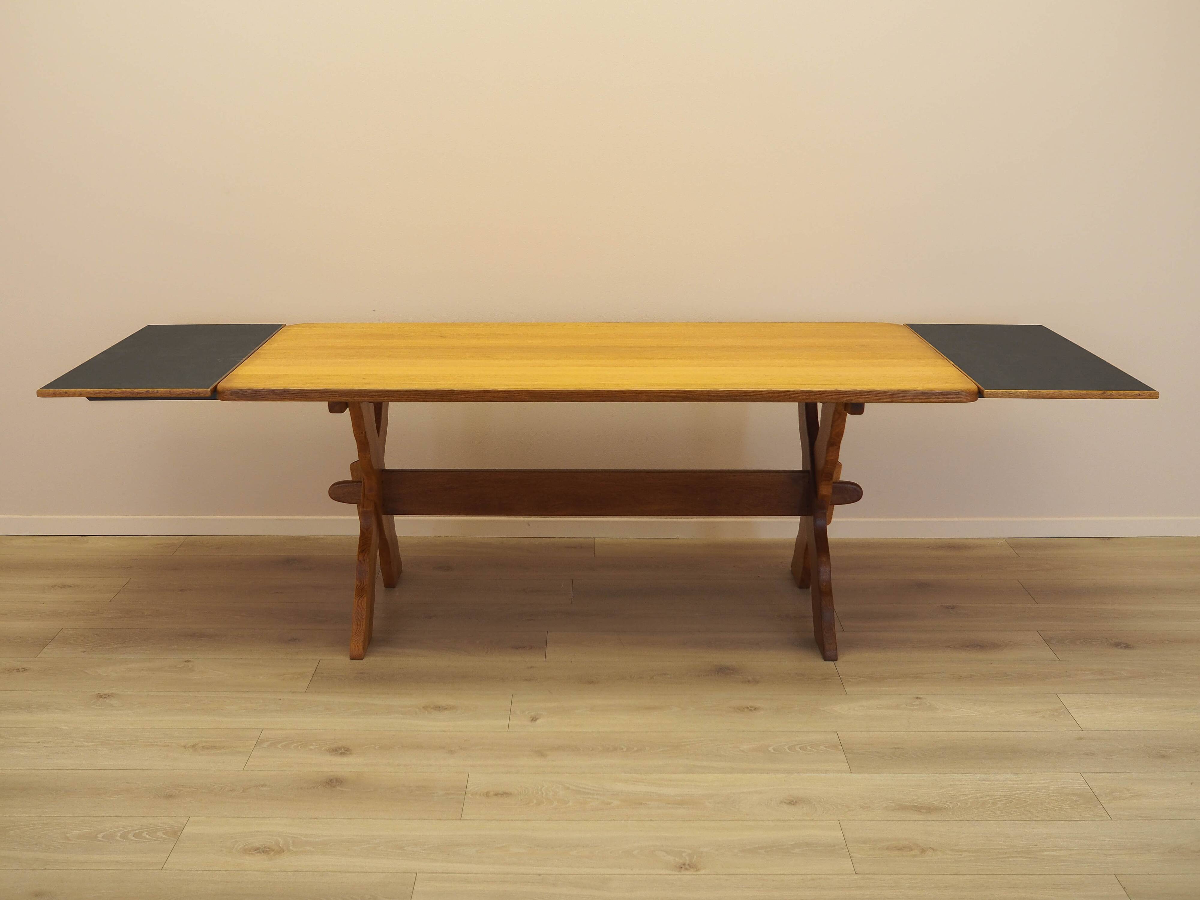 Solid oak dining table by Henning Kjærnulf, Denmark, 1960s