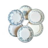 Old mismatched flat plates made of ironstone earthenware.